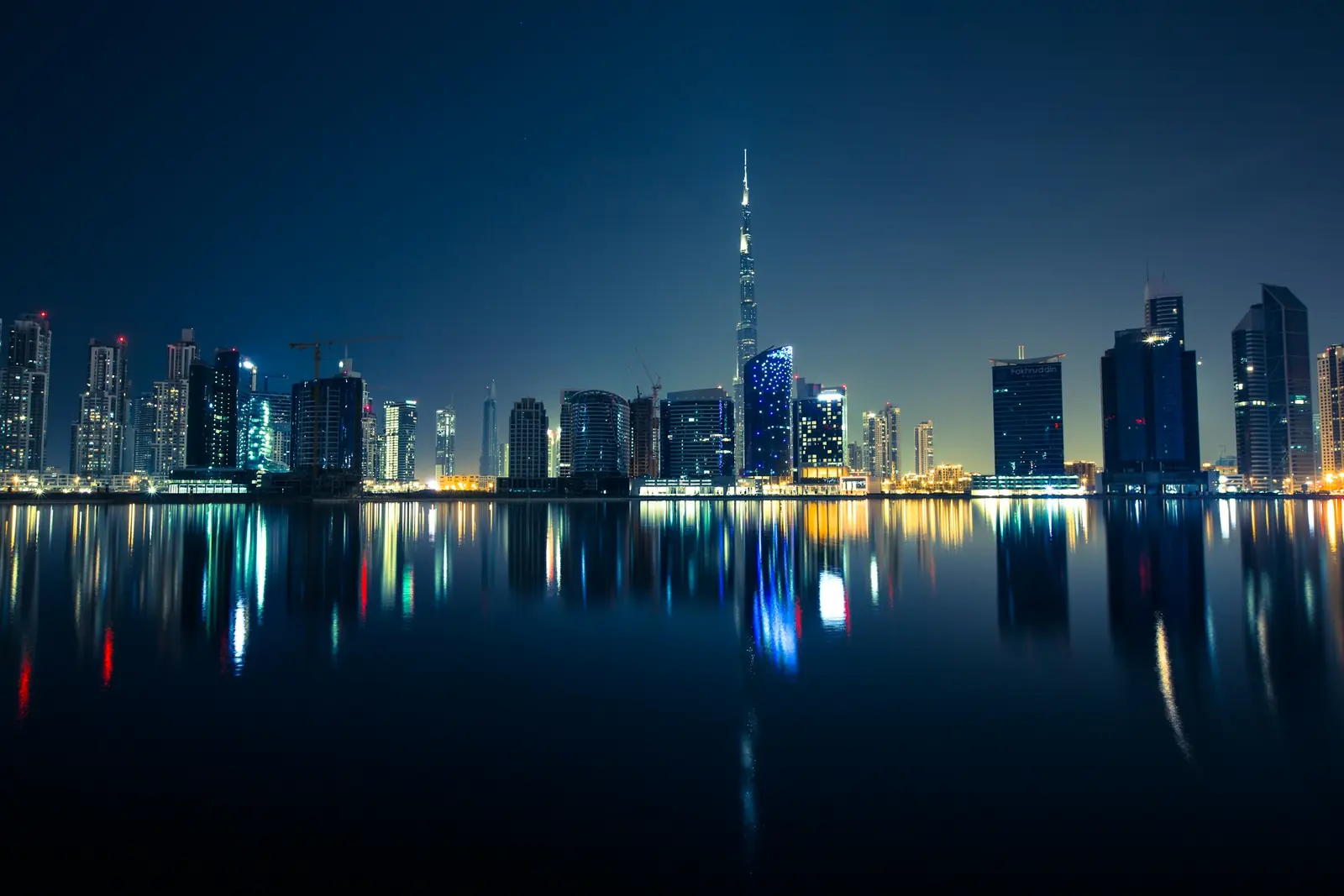 Dubai skyline at night over the water
